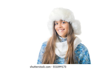 Bright Emotions Of The Girl, Girl In White Winter Hat And A Blue Knit Sweater On White Background. Girl Heard About The Crazy Discounts. Where Prices. Place For Text 