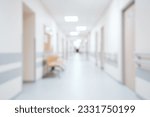 Bright, empty defocused hospital corridor background with copy space