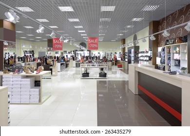 bright and fashionable interior of shoe store in modern mall - Shutterstock ID 263435279