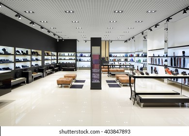 bright and fashionable interior of shoe store in modern mall - Shutterstock ID 403847893
