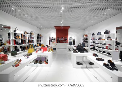 bright and fashionable interior of shoe store in modern mall - Shutterstock ID 776973805