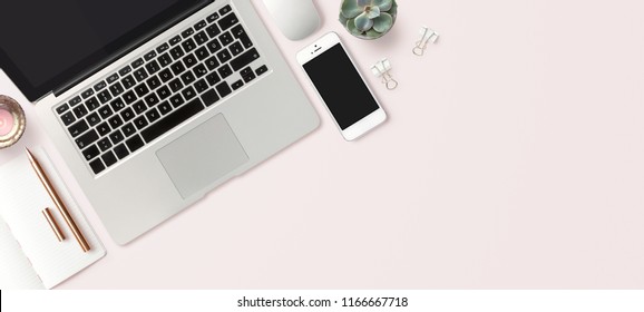 bright feminine banner / header with a stylish workspace with laptop computer, smartphone modern office accessories and a small succulent on a blush table, top view / flat lay - Powered by Shutterstock