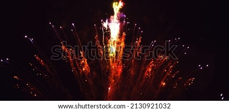 Bright festive fireworks in the night sky. Happy New Year