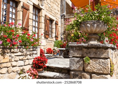 Bright Flower Pots On An Ancient Stone House Porch In Southern France