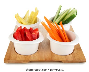 Bright Fresh Vegetables Cut Up Slices In Bowls Isolated On White