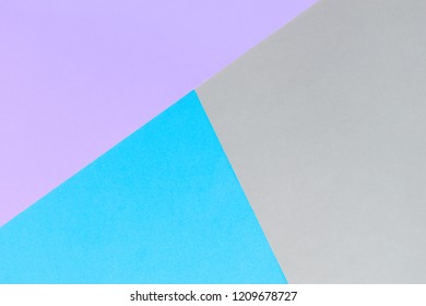 Bright, geometric gray-purple-blue paper background with place for text. Abstract geometric festive background, flat lay