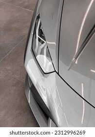 A bright gray Lamborghini Aventador car headlight 