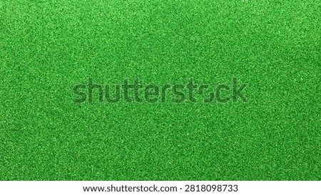 Bright green glitter texture background with sparkling shimmery surface for celebration