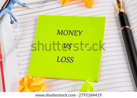 A bright green note captures attention, contrasting with crumpled paper and stationery. It sparks a thought-provoking discussion on finances and value in a workspace.