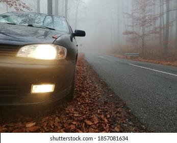 Bright Headlights With Fog Light On The Car In The Forest On Misty Autumn Morning