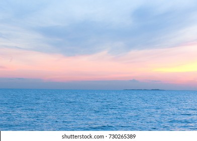 Bright Horizon Sunset Over Water 