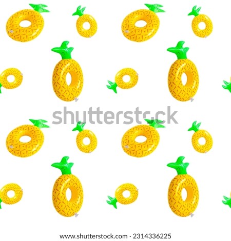 Bright inflatable pineapple ring pettern on white background. Concept summer holidays