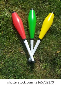 Bright Juggling Clubs On Grass