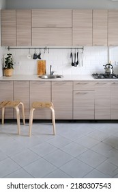 Bright Kitchen Set With Stainless Steel Sink And Facades With Wood Texture