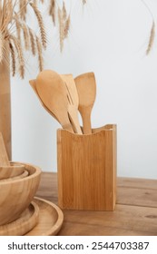 Bright kitchen and wooden kitchen utensils