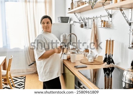 In a bright kitchen, a young plus sized woman prepares her morning coffee, radiating warmth.