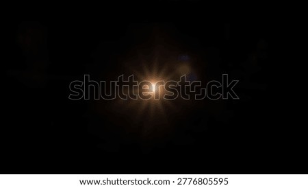 A bright light bursts forth from darkness, creating an abstract star flare effect. This image captures the essence of light, energy, and cosmic phenomena.