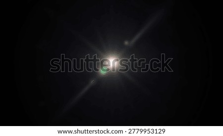 A bright light bursts forth in the darkness, creating a stunning visual display. The image captures the brilliance and intensity of the light source against a black background.