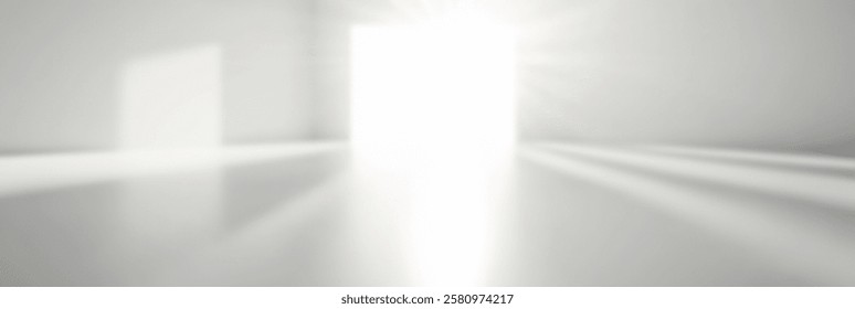 Bright light streaming through an open door in a minimalist white room.