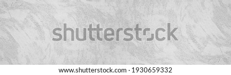 Bright light white gray grey grunge stone concrete plaster facade wall texture background panorama banner long