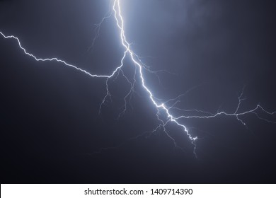 Bright lightning in the black sky over the city - Shutterstock ID 1409714390