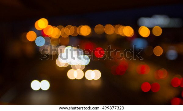 the bright lights of the\
city blurred highway, the lights for the background, bright and\
festive