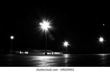 Bright Lights In An Empty Parking Lot At Night.