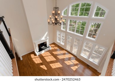 Bright Living Room with High Ceilings, Beautiful Windows and Hardwood Floors - Powered by Shutterstock