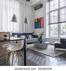 Bright Living Room With Sofa, Armchair And Big Window With Blinds