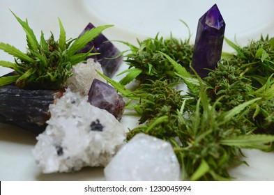 Bright, macro photo of medicinal marijuana. Legal weed, cannabis flowers and healing crystals. Alternative holistic healing, ganja and crystals. Reiki energy healing with THC and CBD. 