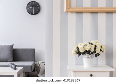 Bright, Modern Living Room With Roses In A Flowerpot On A White Table In The Foreground