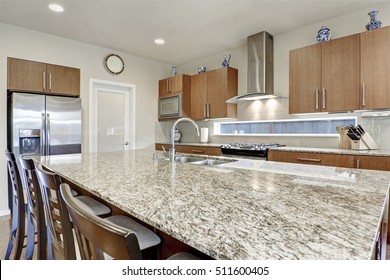 Bright Modern Open Plan Kitchen Room Interior. Large Bar Style Island With Stools, Granite Counter Top And Double Sink With Faucet. . Northwest, USA