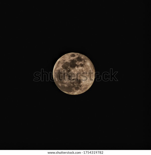 Bright moon with detailed\
structure.