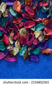 Bright Multi-colored Leaves And Petals Of Dried Flowers On A Brilliant Blue Background. Blank For An Unusual Greeting Card Or Invitation Card For A Creative Meeting. Copy Space. Close-up