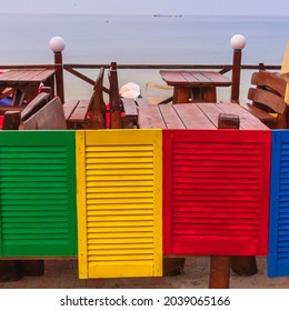 Bright multi-colored small doors as decoration for a beach caf? in the resort town.