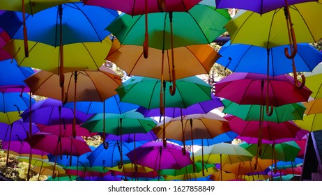 Bright multi-colored umbrellas over the city