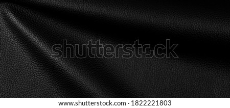 bright natural real black leather with Flexes dark waves background texture abstract close up, horizontal surface studio perfect photography.