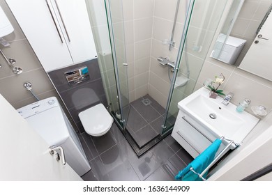 Bright New Bathroom Interior With Glass Walk In Shower With Marble Tile Surround