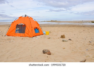 Bright Orange Beach Tent On British Holiday Beach