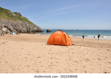 Bright Orange Beach Tent On British Holiday Beach.