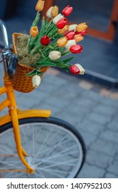 Bright Orange Bike With Basket Of Flowers