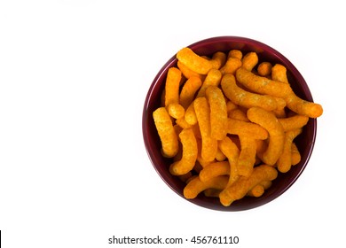 Bright Orange Cheese Puffs In A Red Bowl.