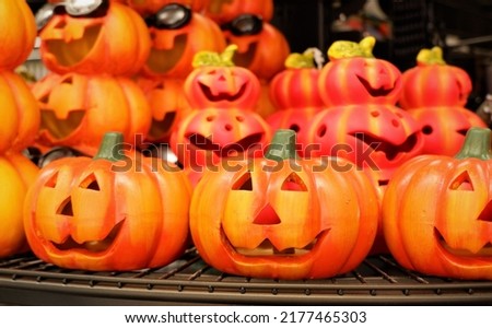 bright orange color clay halloween pumpkin lanterns in a shop in Budapest, Hungary