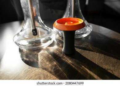 Bright Orange Hookah Bowl Without Tobacco Leaf Standing On The Table. Hookah Details.