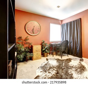 Bright Orange Office Room With Black Furniture And Curtain And Cow Skin Rug On Floor