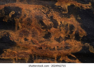 Bright Orange Paint Spots On A Black Tarp.Abstract Background .Fantasy.