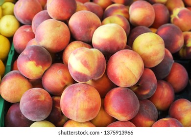 Bright Peaches In The Market