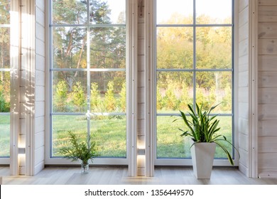 Bright Photo Studio Interior With Big Window, High Ceiling, White Wooden Floor