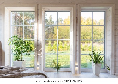 Bright Photo Studio Interior With Big Window, High Ceiling, White Wooden Floor