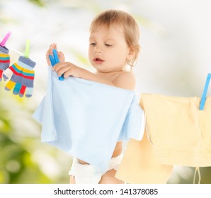 Bright Picture Of Adorable Baby Doing Laundry